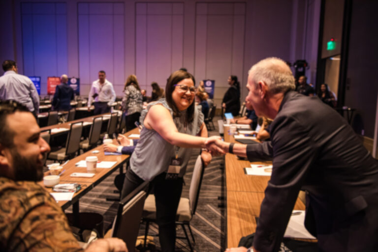 lawyer rumble handshake Angel and attendee
